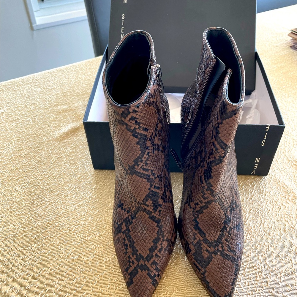 Brand new Steve Madden  snakeskin booties in original box.